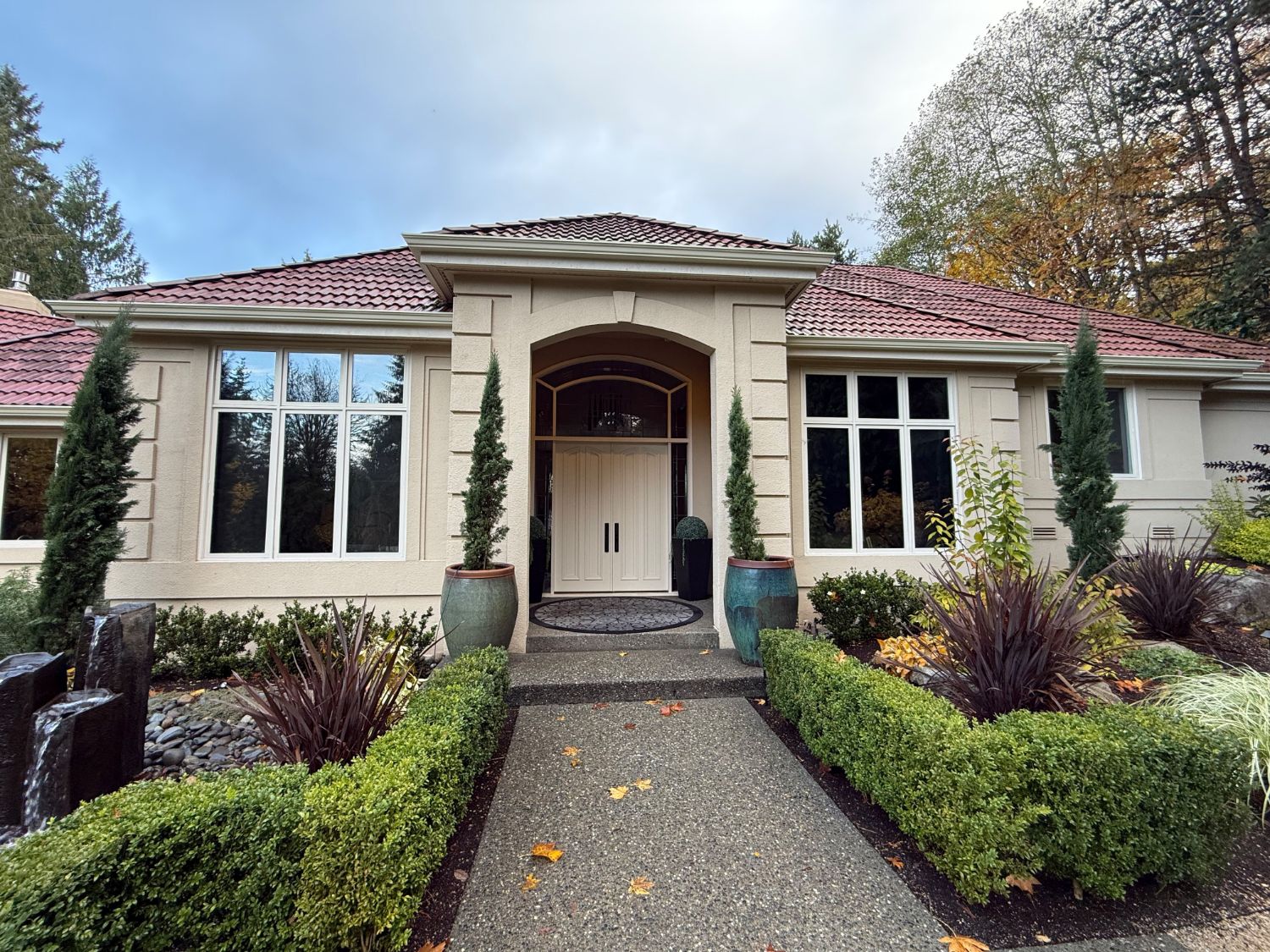 The same home entrance in daylight before lighting installation